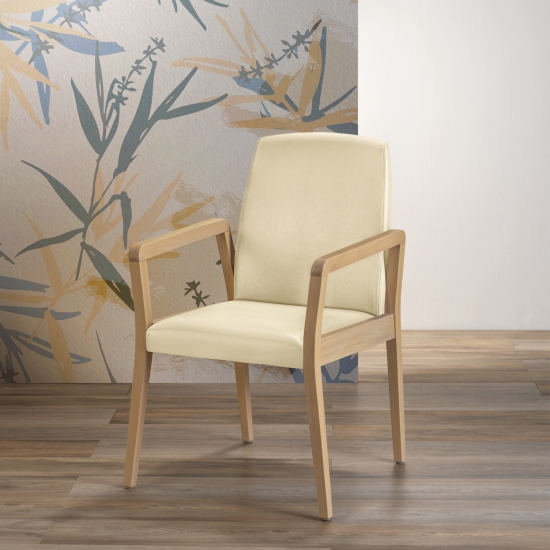 Small armchair with upholstered backrest and seat